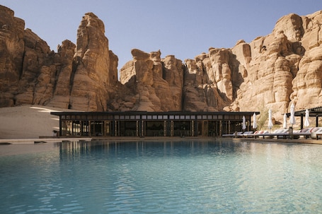 Outdoor pool, open 7:00 AM to 10:00 PM, pool umbrellas, sun loungers