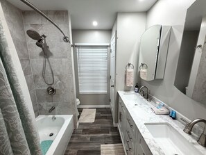 Combined shower/tub, hair dryer, towels, soap