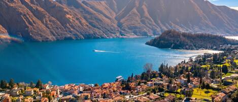 A coastal town with a view of mountains and a lake.