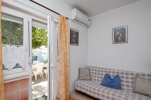 Apartment | Living room | 30-inch TV with digital channels, fireplace - A 1 - apt Near Beach With Patio, Parking and Grill (Split)