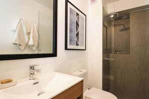 Shower, hair dryer, towels, shampoo