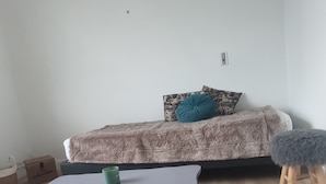 A bedroom with a bed, a small table, and a stool. - Mountain spirit, adventure on your doorstep (BARLEST)