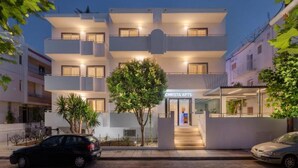A modern two-story building with a sign reading "CHRISTA APTS". - Christa (Kos)