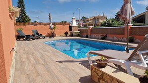 A swimming pool with lounge chairs and a potted cactus. - "Mireli"@MARISOL: 300m to the beach, private pool, A/C, WiFi, dog beach. (Riumar)