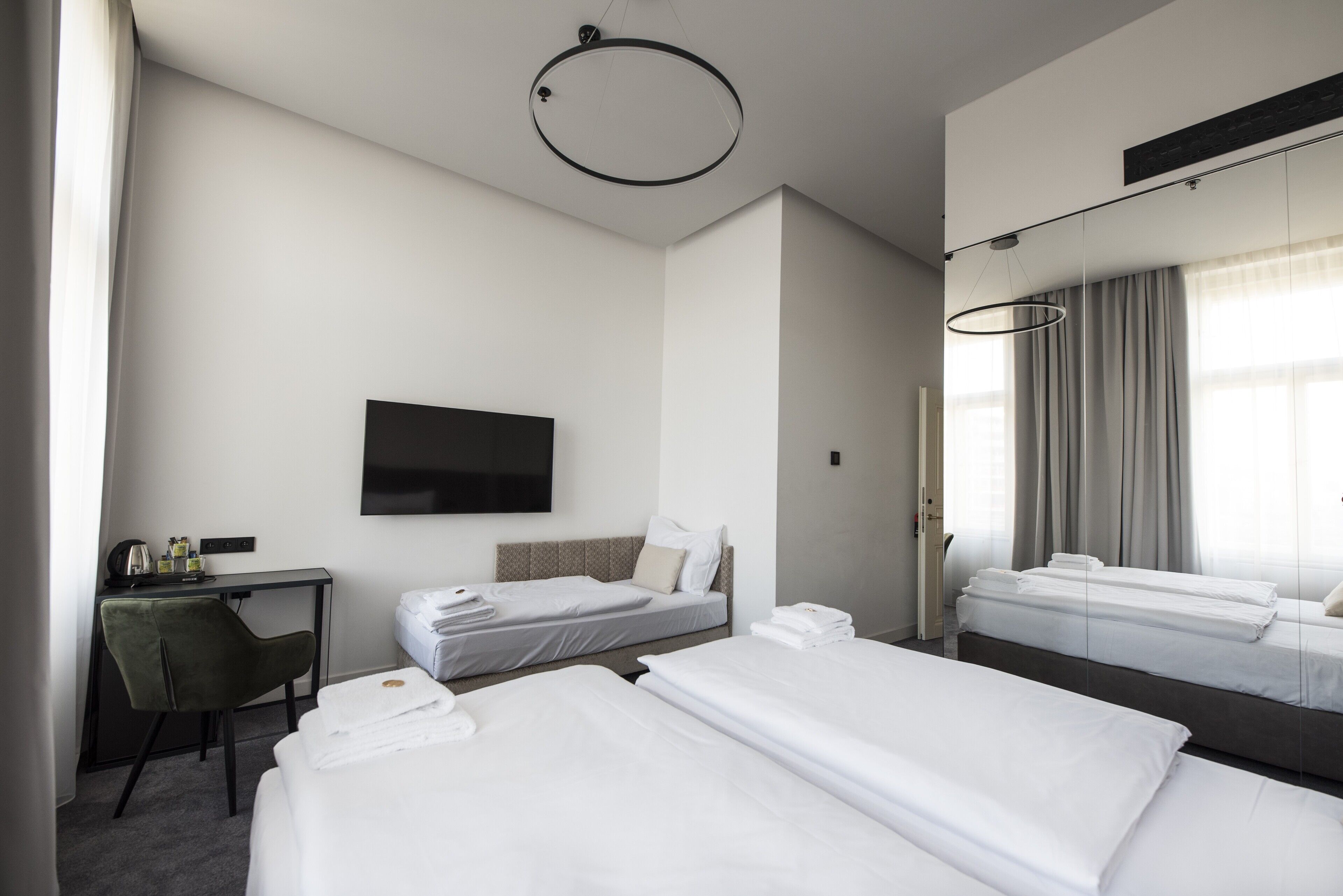 superior triple room | minibar, in-room safe, blackout curtains, iron/ironing board