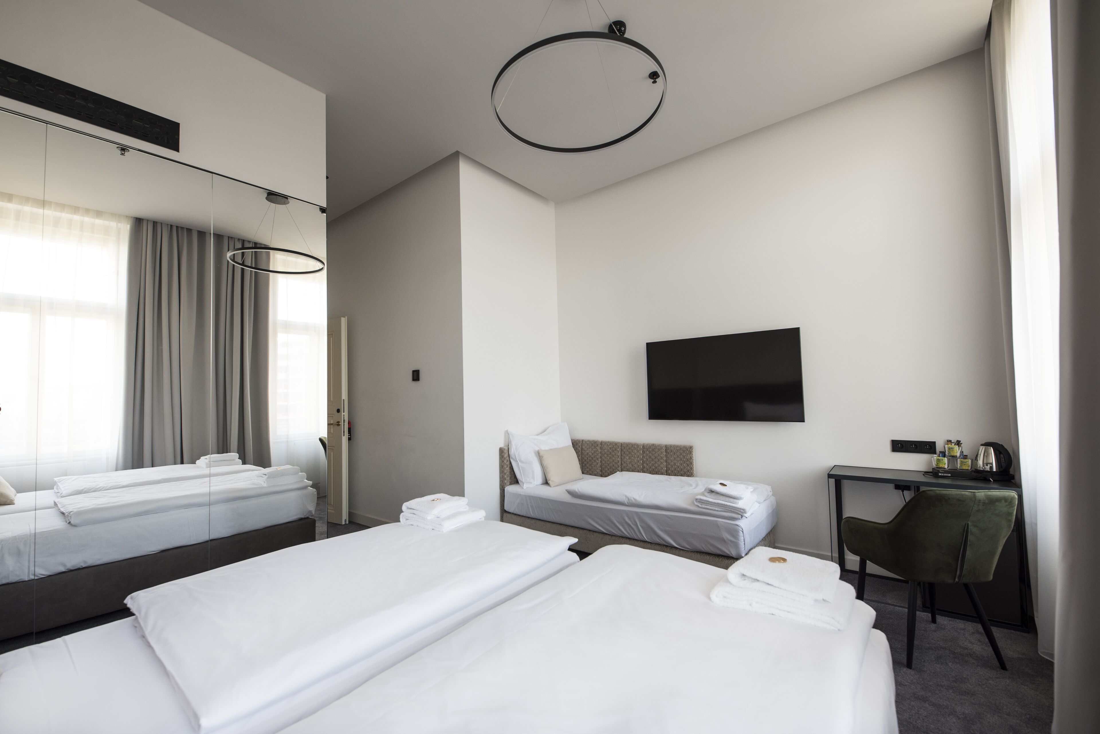 superior triple room | minibar, in-room safe, blackout curtains, iron/ironing board