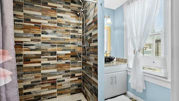 Shower, hair dryer, towels, shampoo