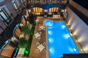 A rooftop pool area with lounge seating and a hot tub. - Oscar Boutique Hotel (Tashkent)