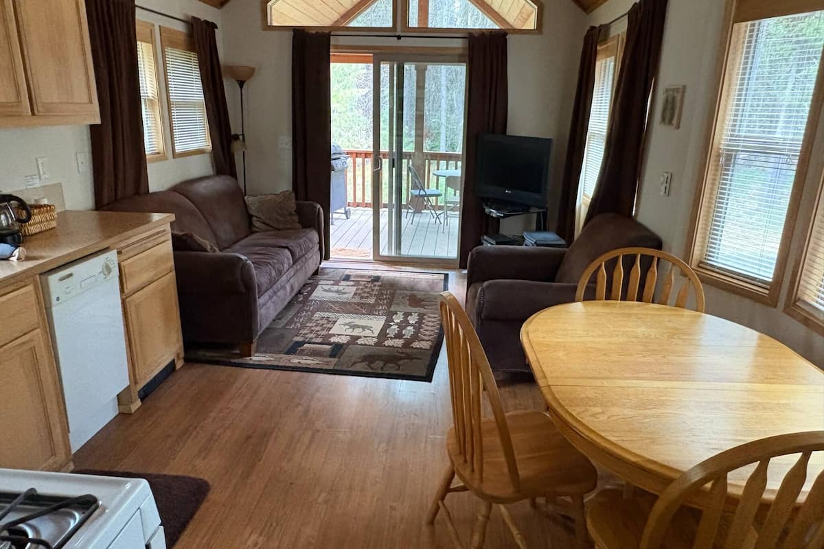 standard cabin (young at heart) | living area | 32-inch flat-screen tv with satellite channels, tv, dvd player