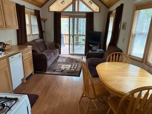 Standard Cabin (Young at Heart) | Living area | 32-inch flat-screen TV with satellite channels, TV, DVD player - Willamette Pass Inn Chalets (Crescent)