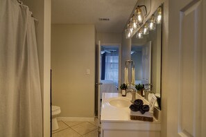 Combined shower/tub, hair dryer, towels, soap