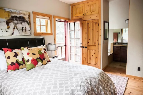 Master bedroom with en suite bathroom and upper deck