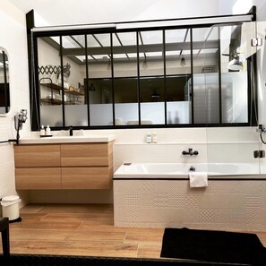 Bathtub, hair dryer, towels, soap