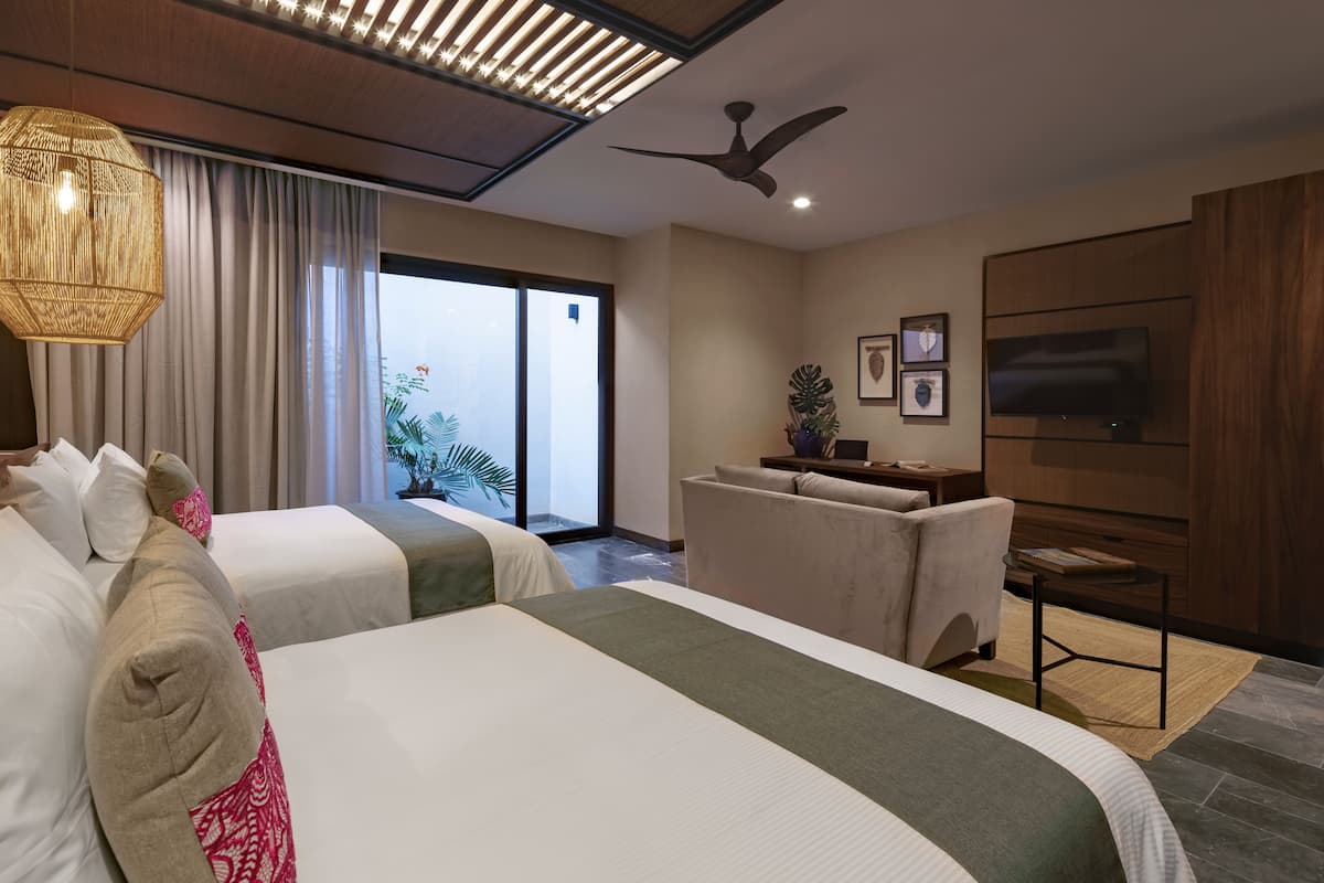 family room | 1 bedroom, premium bedding, minibar, in-room safe