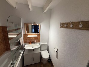 Bathtub, hair dryer, towels