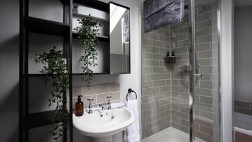 Bathtub, hair dryer, towels, soap