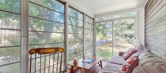 Rustic beach cottage with partial lake views, grill, & WiFi - great location