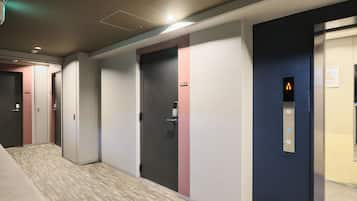 A hallway with multiple doors, some with numbers and others with symbols, leading to different rooms.