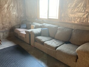 Relax on the large sectional sofa with a partial view of the surrounding area.