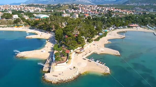 An aerial view of a coastal area with a beach, boats, and a marina. - A 2  apt near beach w patio, parking and grill (Stobrec)