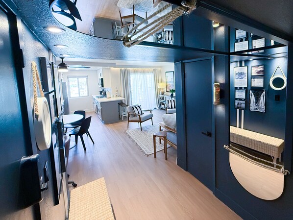 A modern interior with a kitchen, dining area, and living space.