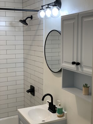Combined shower/bathtub, hair dryer, towels, soap