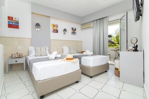 A hotel room with two beds, a nightstand, a dresser, and a window with curtains. - Icandy Malia (Hersonissos)