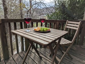 Outdoor dining - Stay in the Treehouse Lodge! Hot tub, game room, fire place, wrap around porch! (Bryson City)