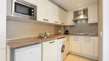 Microwave, toaster, dining tables