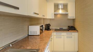 Microwave, toaster, dining tables