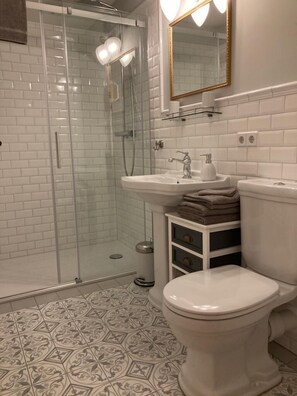 Shower, hair dryer, towels, soap