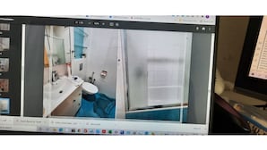 A computer screen displaying a room with a bathroom, a sink, and a mirror. - Har nof penthouse (Jerusalem)