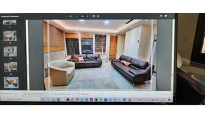 A modern living room with a sofa, armchair, and a coffee table. - Har nof penthouse (Jerusalem)