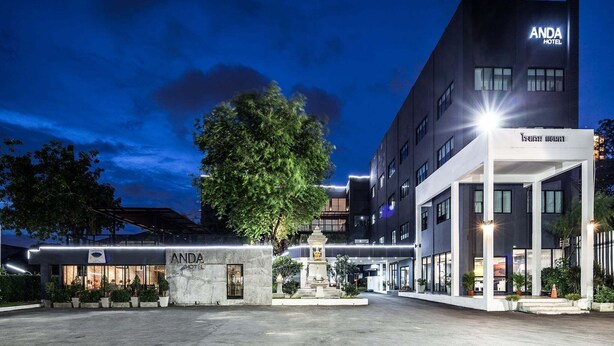 A modern hotel with a prominent entrance, a well-lit facade, and a clear sky. - Anda Bangkok Hotel (Bangkok)