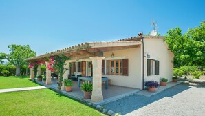 A house with a patio, outdoor seating, and potted plants. - Borges, 5StarsHome Mallorca Estate (Alcúdia)