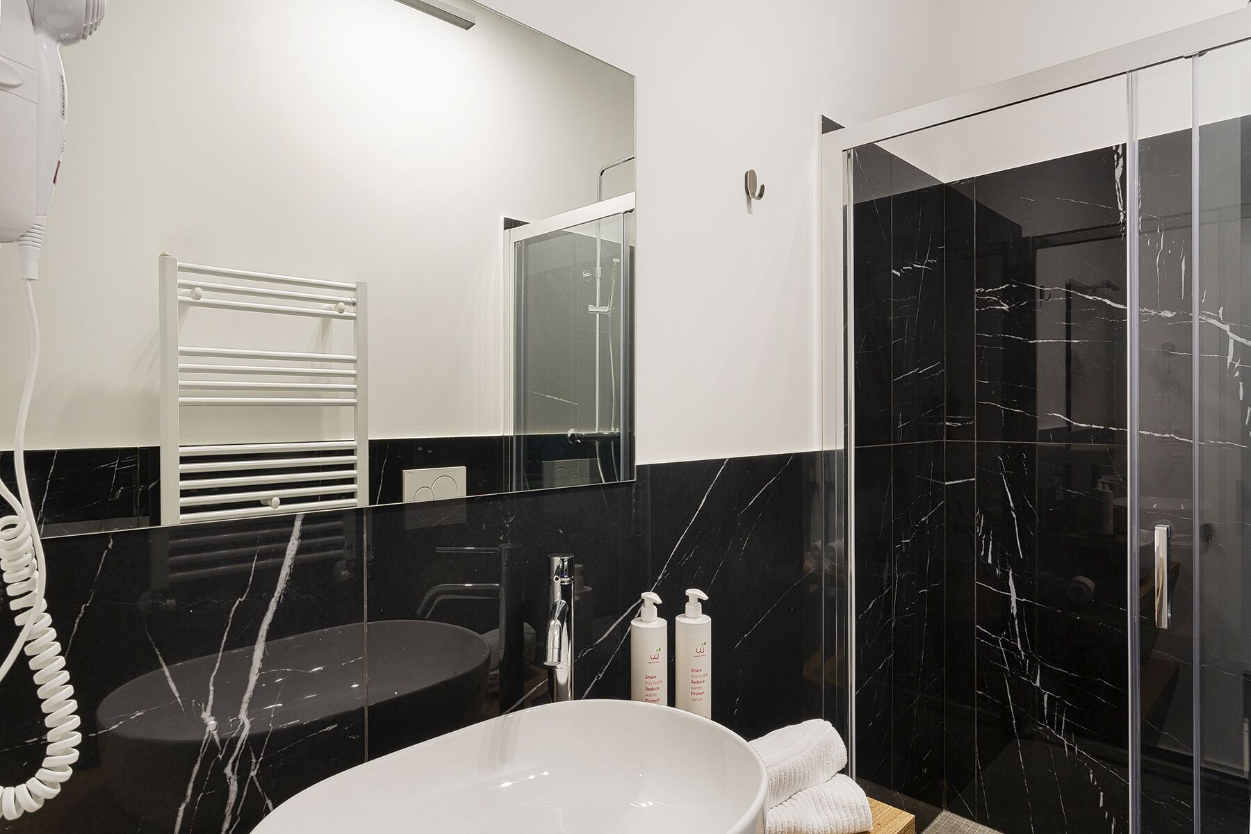Classic Apartment | Bathroom | Shower, hair dryer, soap, shampoo
