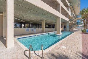 Enjoy a refreshing swim in the pool surrounded by a spacious deck.
