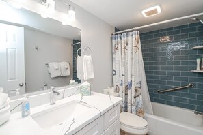Bathtub, hair dryer, towels