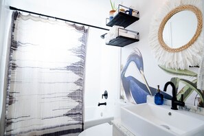 Combined shower/tub, hair dryer, towels, soap