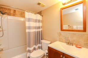 Bathtub, hair dryer, towels