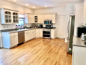 Microwave, dishwasher, coffee/tea maker, cookware/dishes/utensils