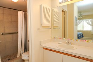 Bathtub, hair dryer, towels, soap