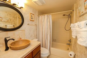 Bathtub, hair dryer, towels, soap