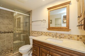 Bathtub, hair dryer, towels, soap