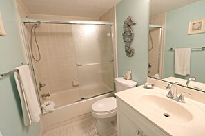 Bathtub, hair dryer, towels, soap