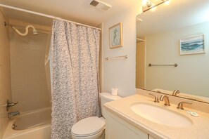 Bathtub, hair dryer, towels