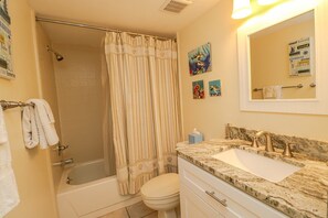 Bathtub, hair dryer, towels, soap