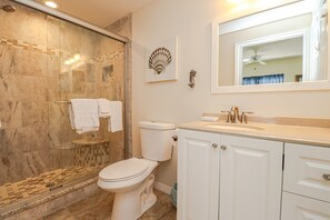 Bathtub, hair dryer, towels, soap