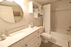 Bathtub, hair dryer, towels, soap