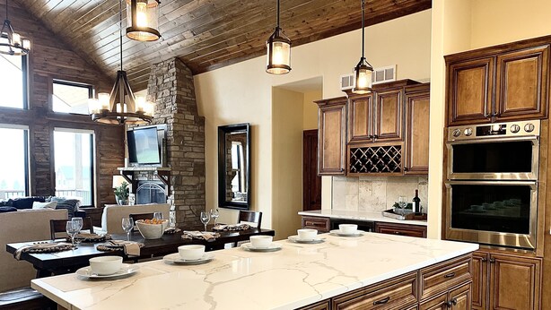 A spacious kitchen with a large island, wooden cabinets, and stainless steel appliances. - Luxury Mountain Home in Grand Lake - Hot Tub (Grand Lake)